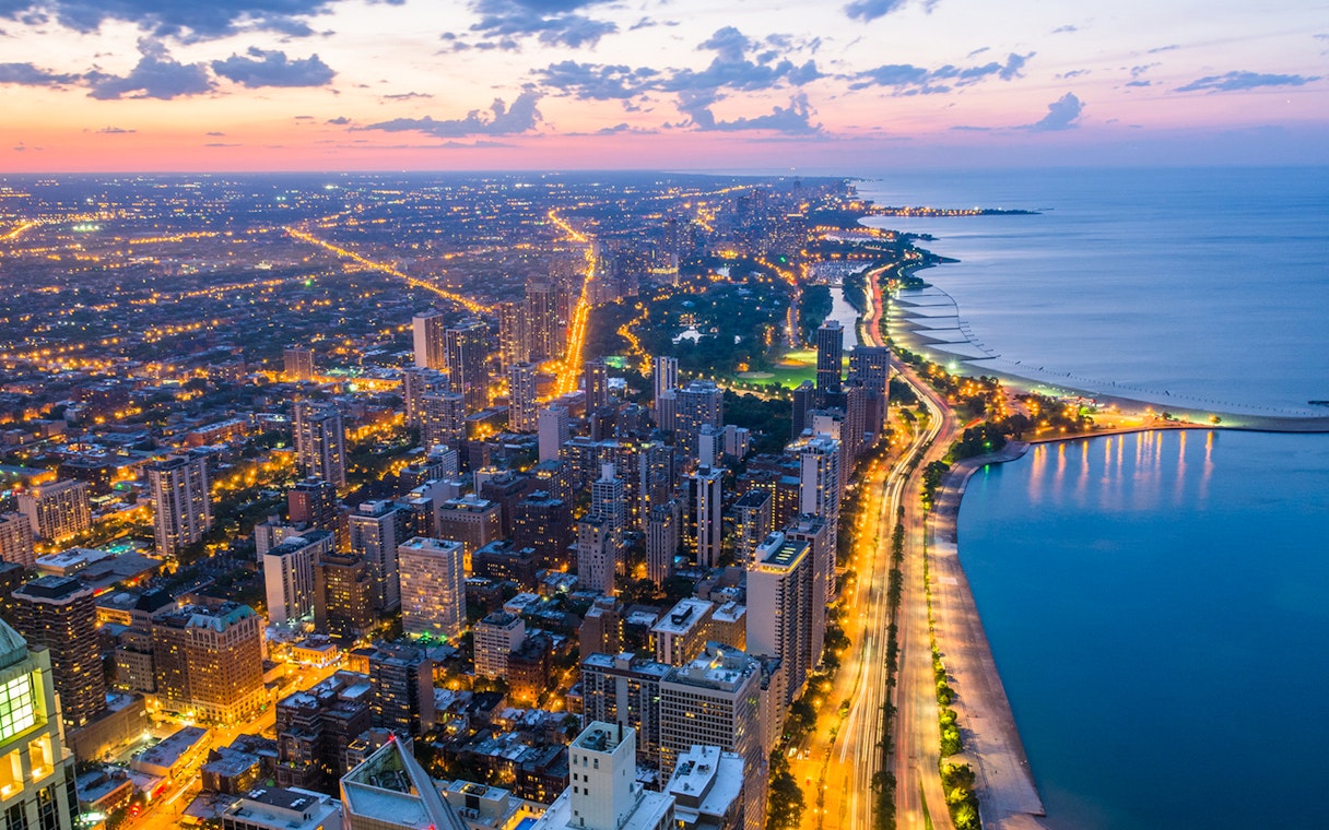 Chicago skyline and Lake Michigan view from 360 Observation Deck at sunset.
