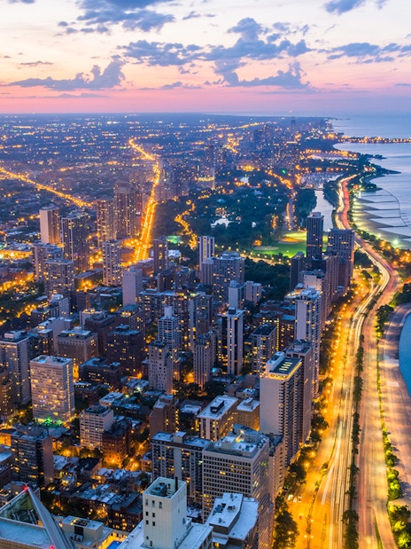Chicago skyline and Lake Michigan view from 360 Observation Deck at sunset.