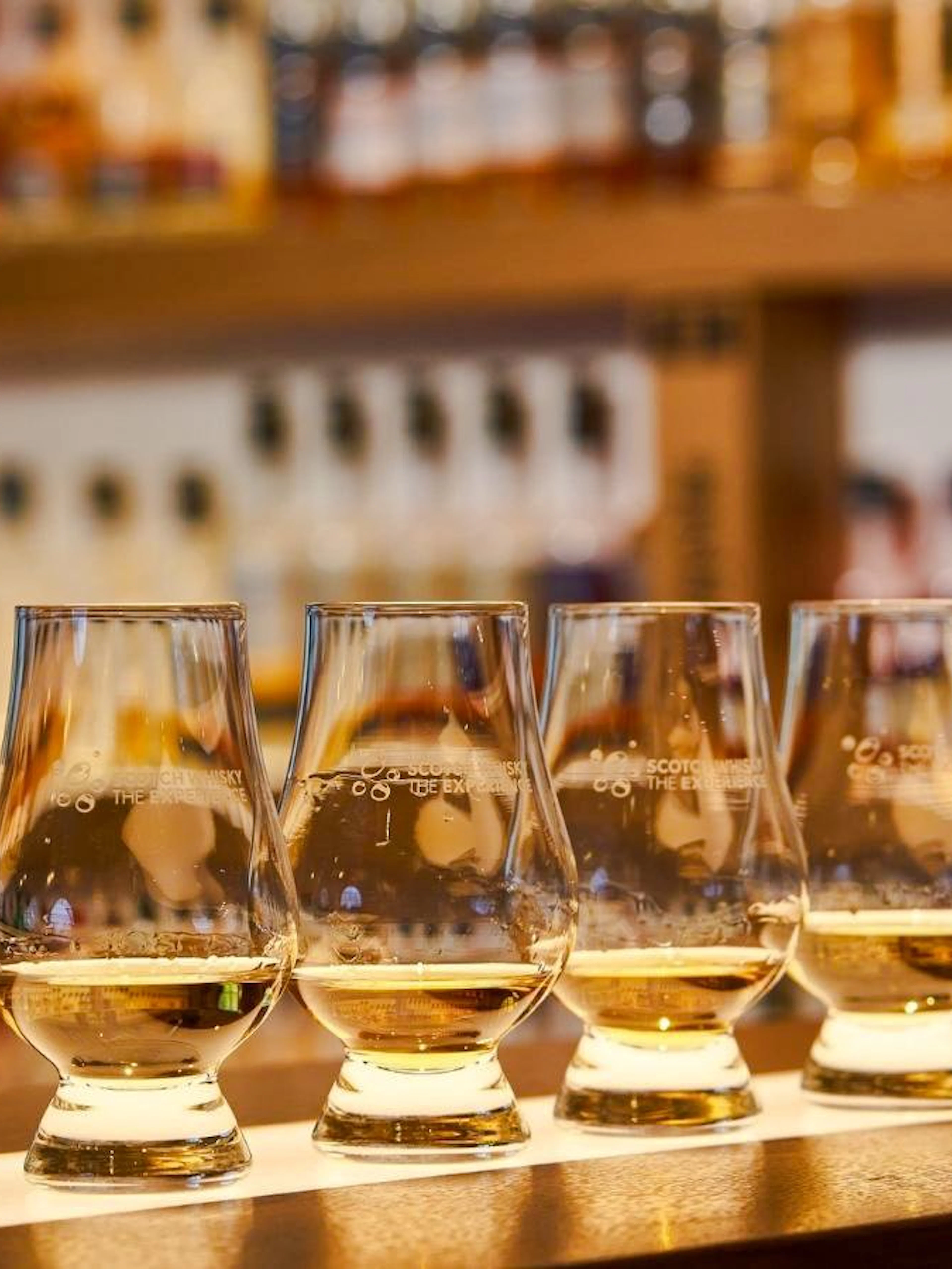 Four glasses of whiskey for tasting at A Taste of Scotland experience.