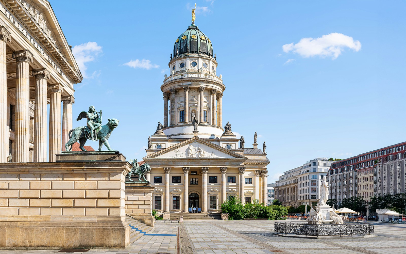 French Cathedral at Gendarmenmarkt, Berlin, with statue and Konzerthaus in view.
