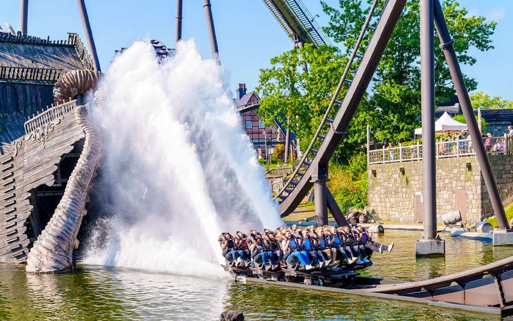 Roller coaster splashing into water at Heide Park, Germany.