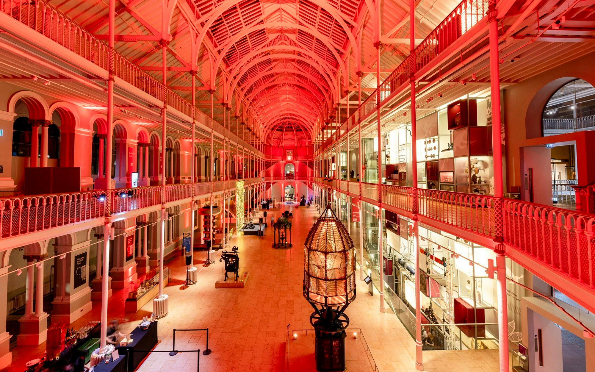 National Museum of Scotland interior with illuminated exhibits and arched ceiling.