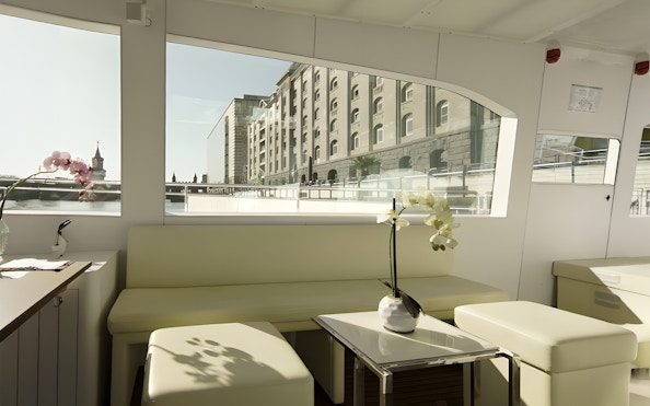 Berlin solar catamaran interior with city view through large windows.