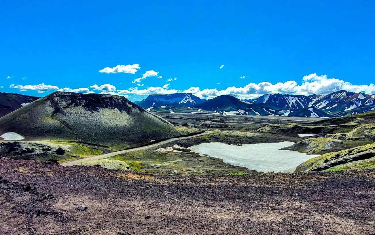 Landmannalaugar Highlands landscape with volcanic hills and snow patches, Iceland.