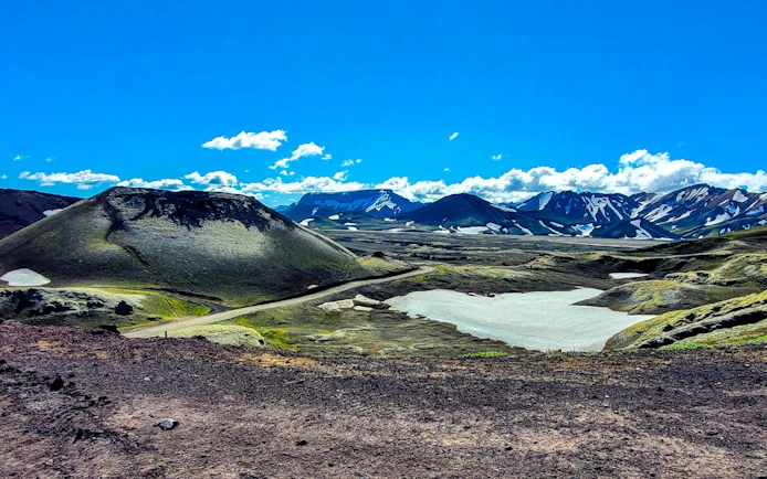 Landmannalaugar Highlands landscape with volcanic hills and snow patches, Iceland.