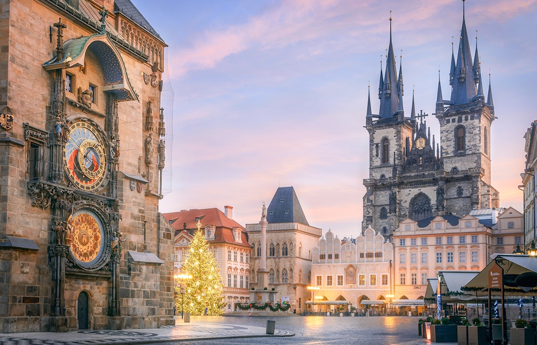 Old Town Square in the early morning with Astronomical Clock in the foreground