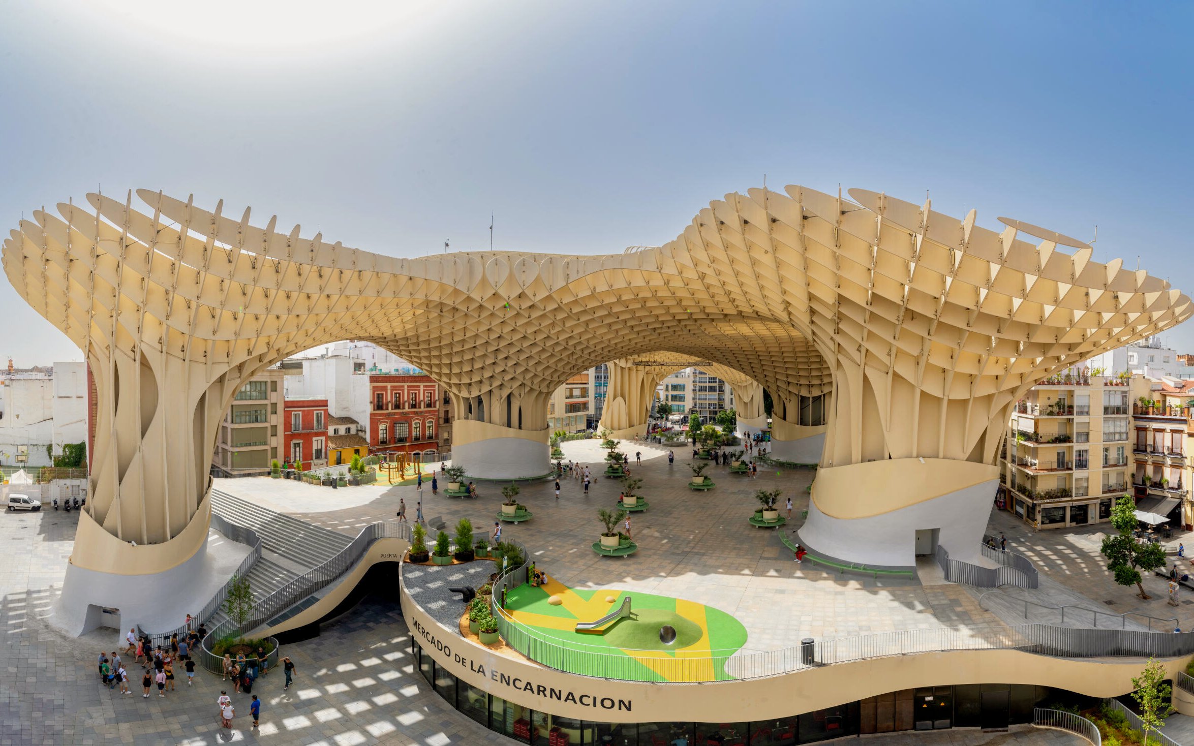 Visitors exploring the wooden structure of Setas de Sevilla, Spain.