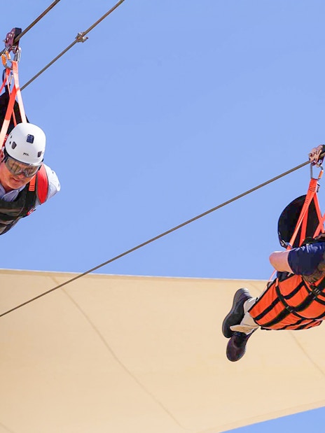 Ziplining adventure at Jais, UAE with two people in harnesses.