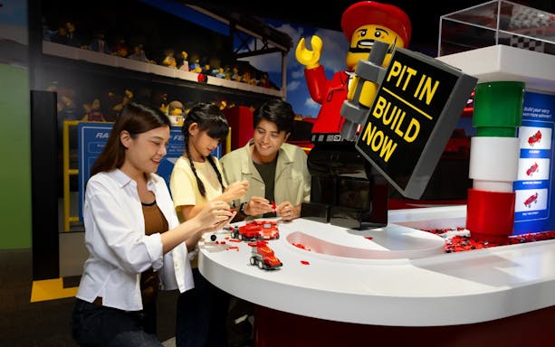 Visitors building Lego models at Legoland Malaysia.