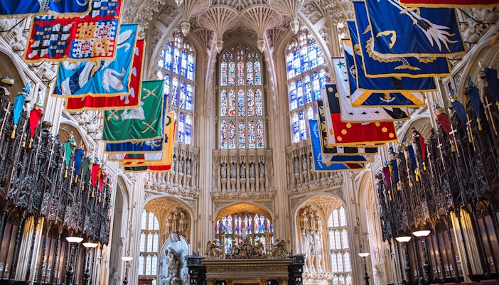 Henry VII Lady Chapel interior with colorful banners, Westminster Abbey, London.
