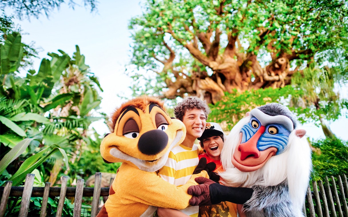 Kids hugging Lion King characters at Animal Kingdom, Walt Disney World, Orlando.