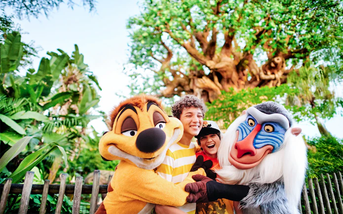 Kids hugging Lion King characters at Animal Kingdom, Walt Disney World, Orlando.
