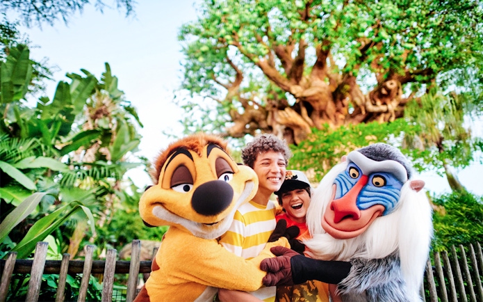 Kids hugging Lion King characters at Animal Kingdom, Walt Disney World, Orlando.