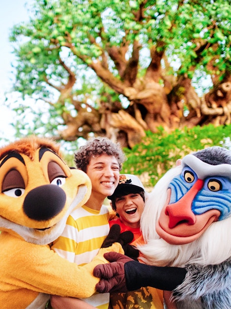 Kids hugging Lion King characters at Animal Kingdom, Walt Disney World, Orlando.