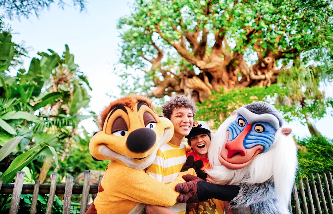 Kids hugging Lion King characters at Animal Kingdom, Walt Disney World, Orlando.