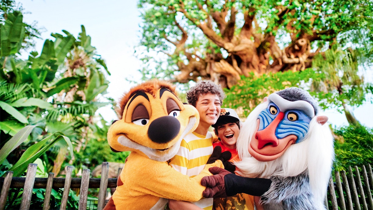 Kids hugging Lion King characters at Animal Kingdom, Walt Disney World, Orlando.
