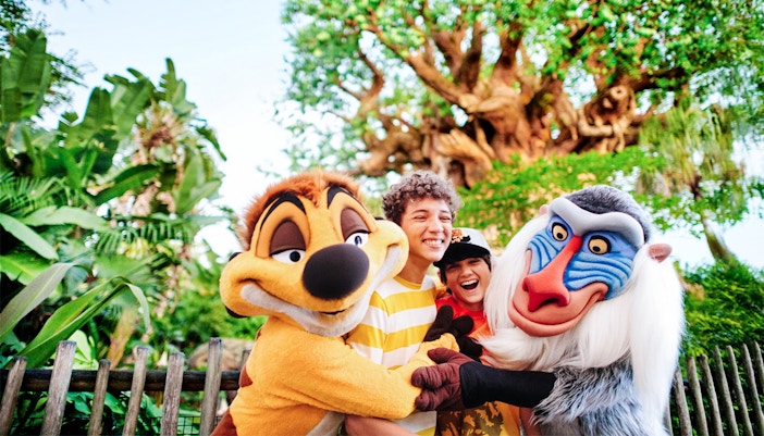 Kids hugging Lion King characters at Animal Kingdom, Walt Disney World, Orlando.