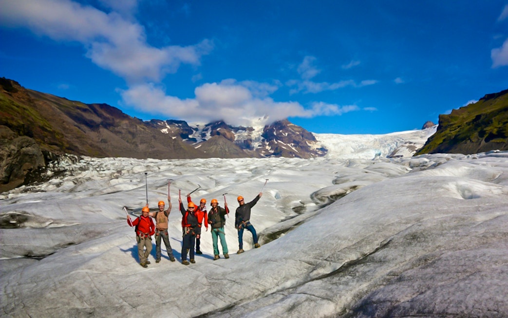 Guests hiking and ice climbing on a glacier in Skaftafell, Iceland.