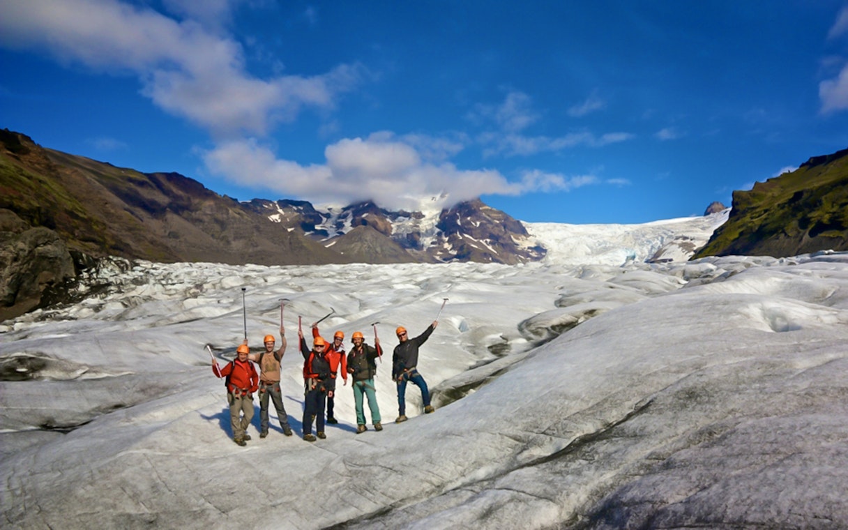 Guests hiking and ice climbing on a glacier in Skaftafell, Iceland.