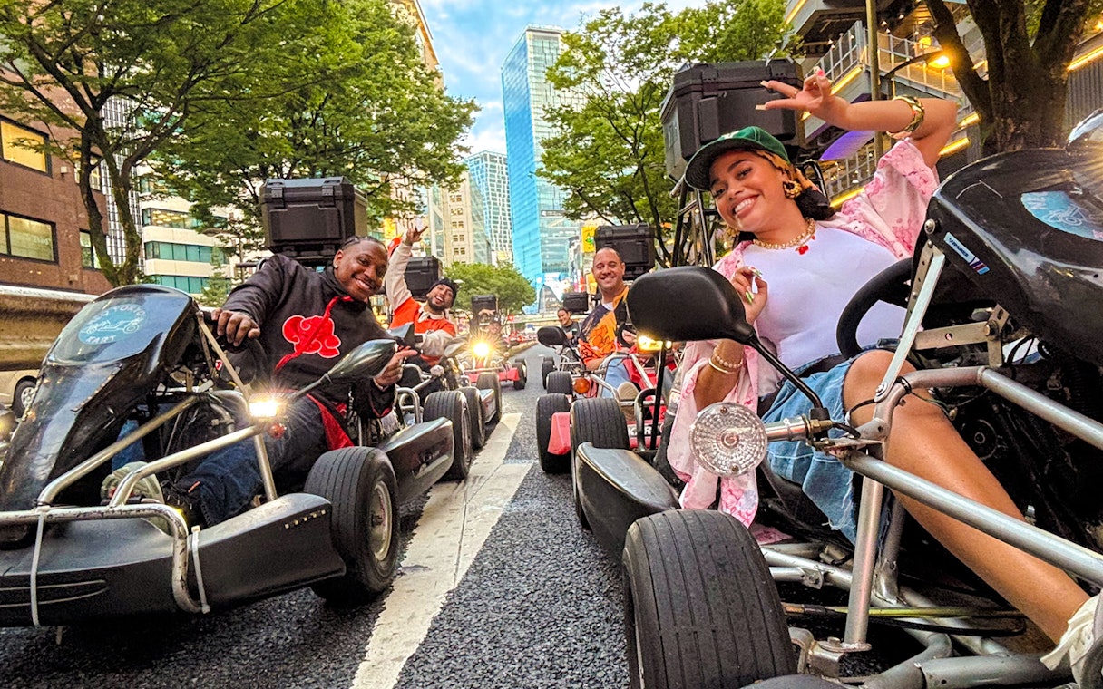 Friends enjoying a go-kart ride on the streets of Shibuya, Tokyo.