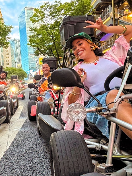 Friends enjoying a go-kart ride on the streets of Shibuya, Tokyo.