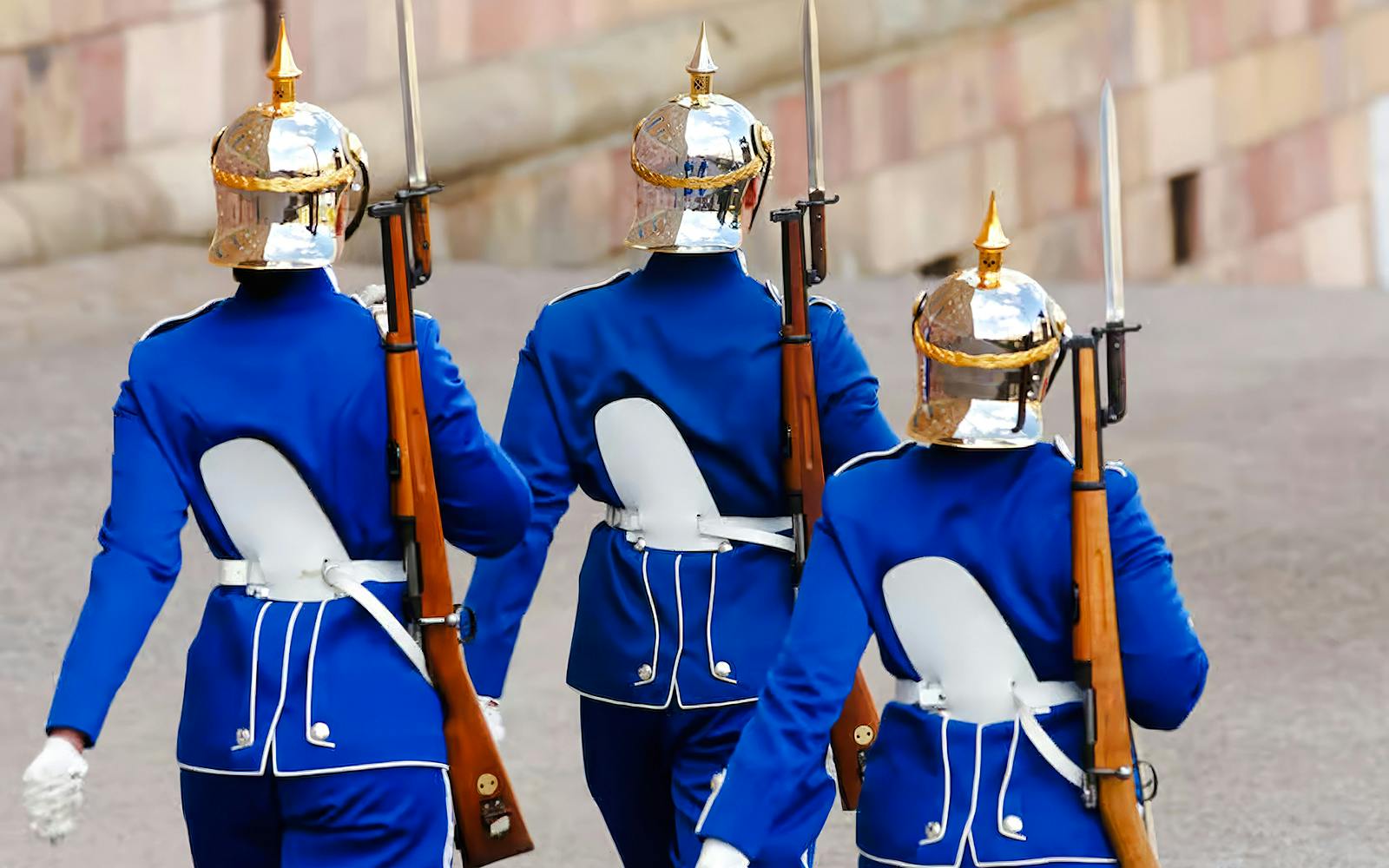 Royal guards in blue uniforms marching at the Changing of the Guard ceremony, Royal Palace, Stockholm.