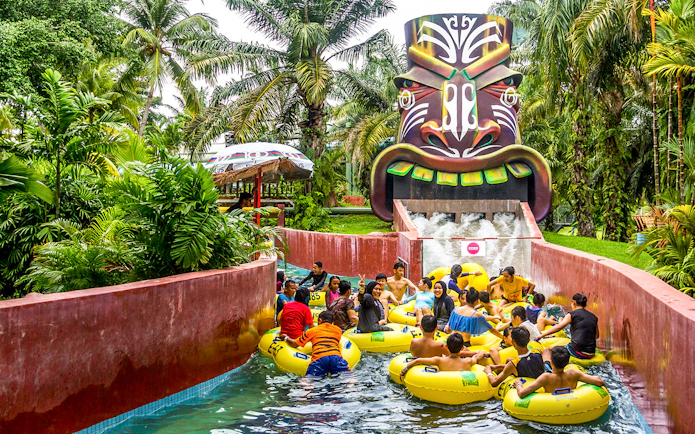 Visitors enjoying a water ride at A'Famosa Melaka Waterpark, Malaysia.