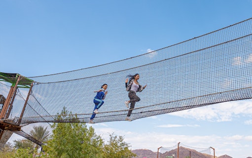 Visitors running on a suspended net at Hatta Wadi Hub, Dubai.
