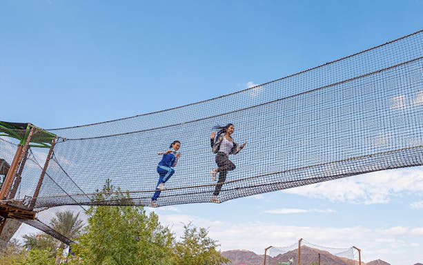 Visitors running on a suspended net at Hatta Wadi Hub, Dubai.