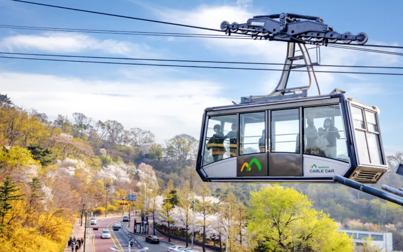 Namsan Cable Car over scenic spring landscape in Seoul, South Korea.