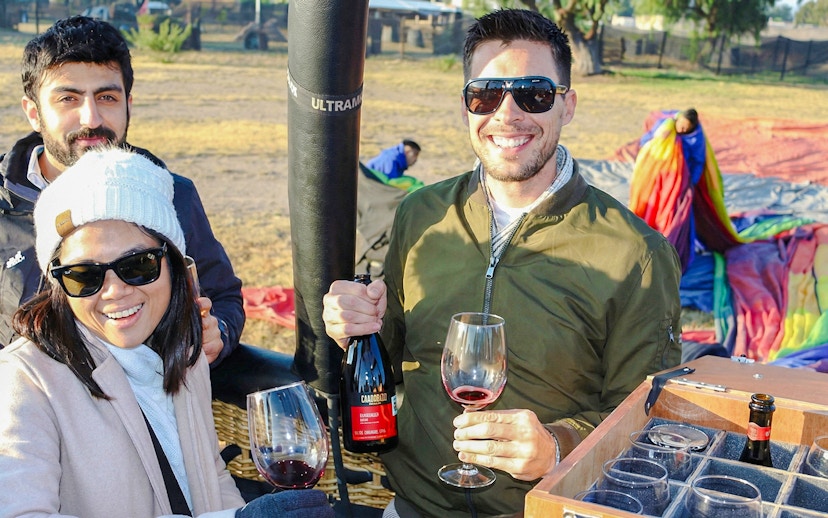 Tourists enjoying wine before a balloon flight at Teotihuacán.