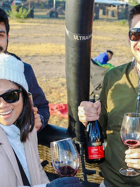 Tourists enjoying wine before a balloon flight at Teotihuacán.
