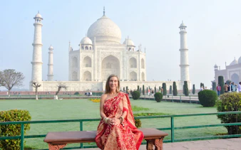 Taj Mahal with visitor in traditional attire, Agra Express Entry Tour.