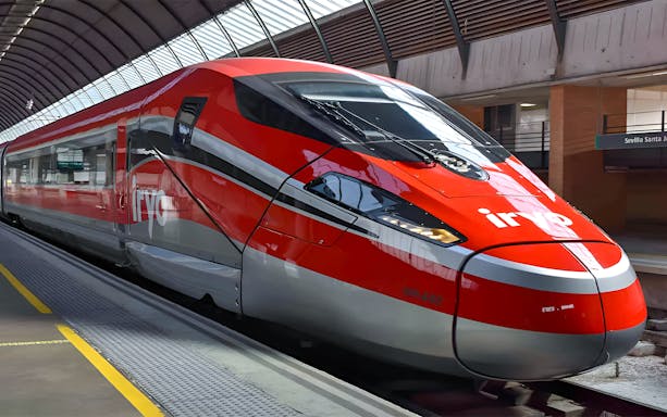 High-speed train at Madrid Atocha station for Barcelona route.