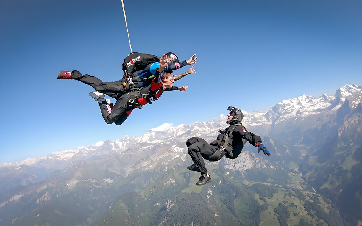 Tandem skydive over Swiss Alps from 13,000 ft with instructor and breathtaking mountain views.