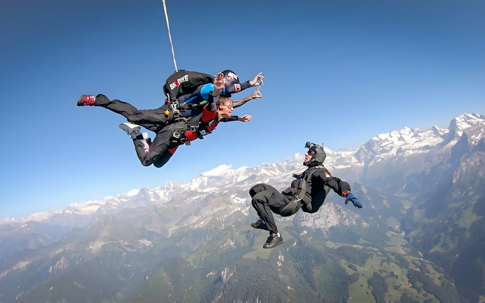 Tandem skydive over Swiss Alps from 13,000 ft with instructor and breathtaking mountain views.