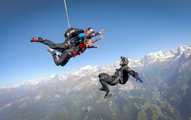 Tandem skydive over Swiss Alps from 13,000 ft with instructor and breathtaking mountain views.