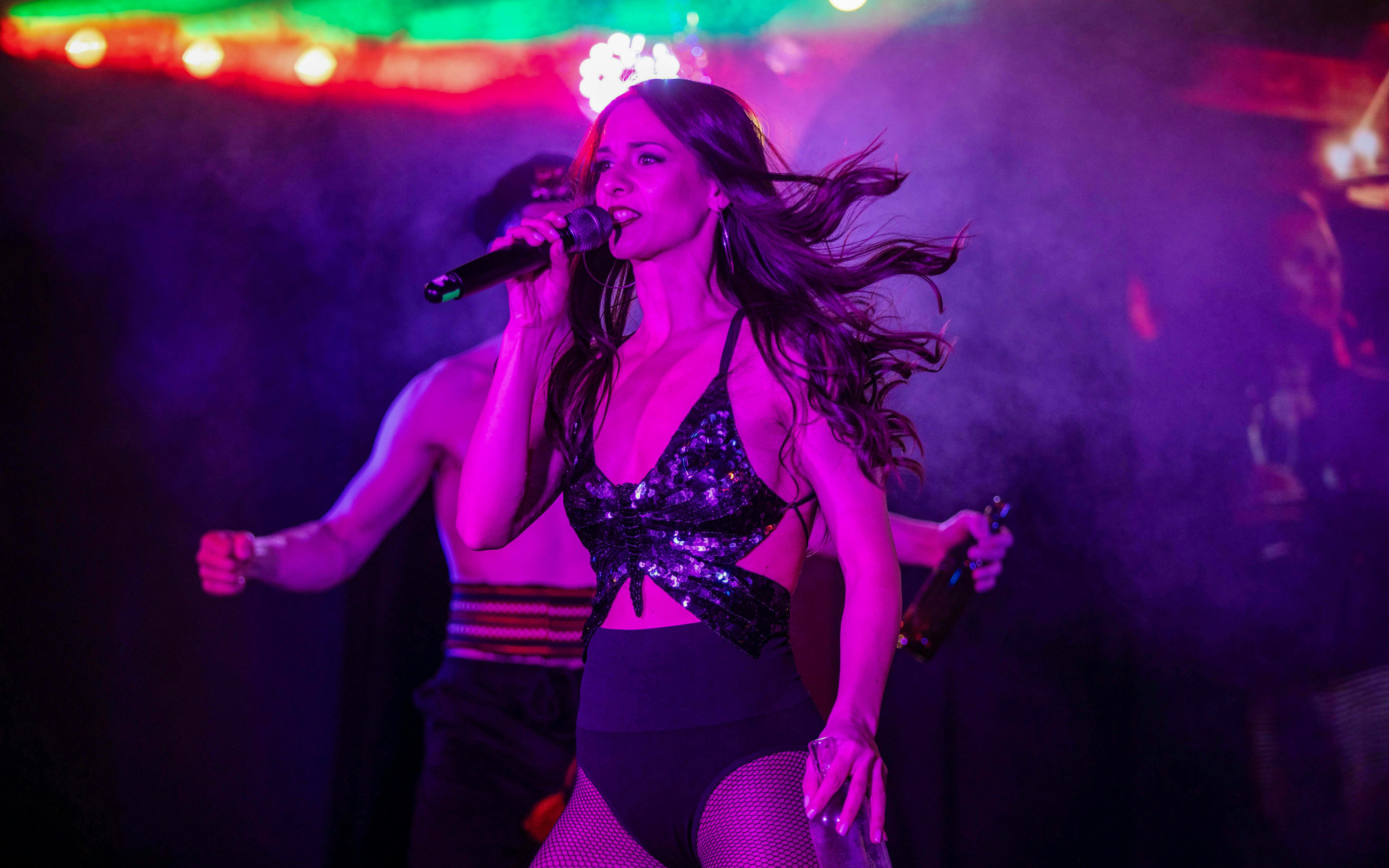Performer singing at Cabaret & Burlesque Show, Voros Neon Theatre, Budapest.
