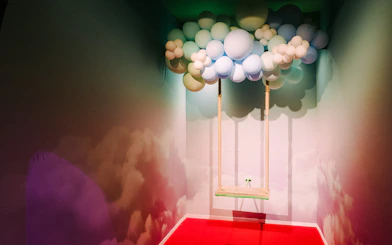 Swing under balloon cloud installation at Bubble Planet, Seattle.