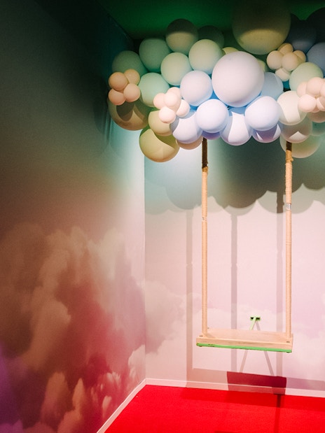 Swing under balloon cloud installation at Bubble Planet, Seattle.