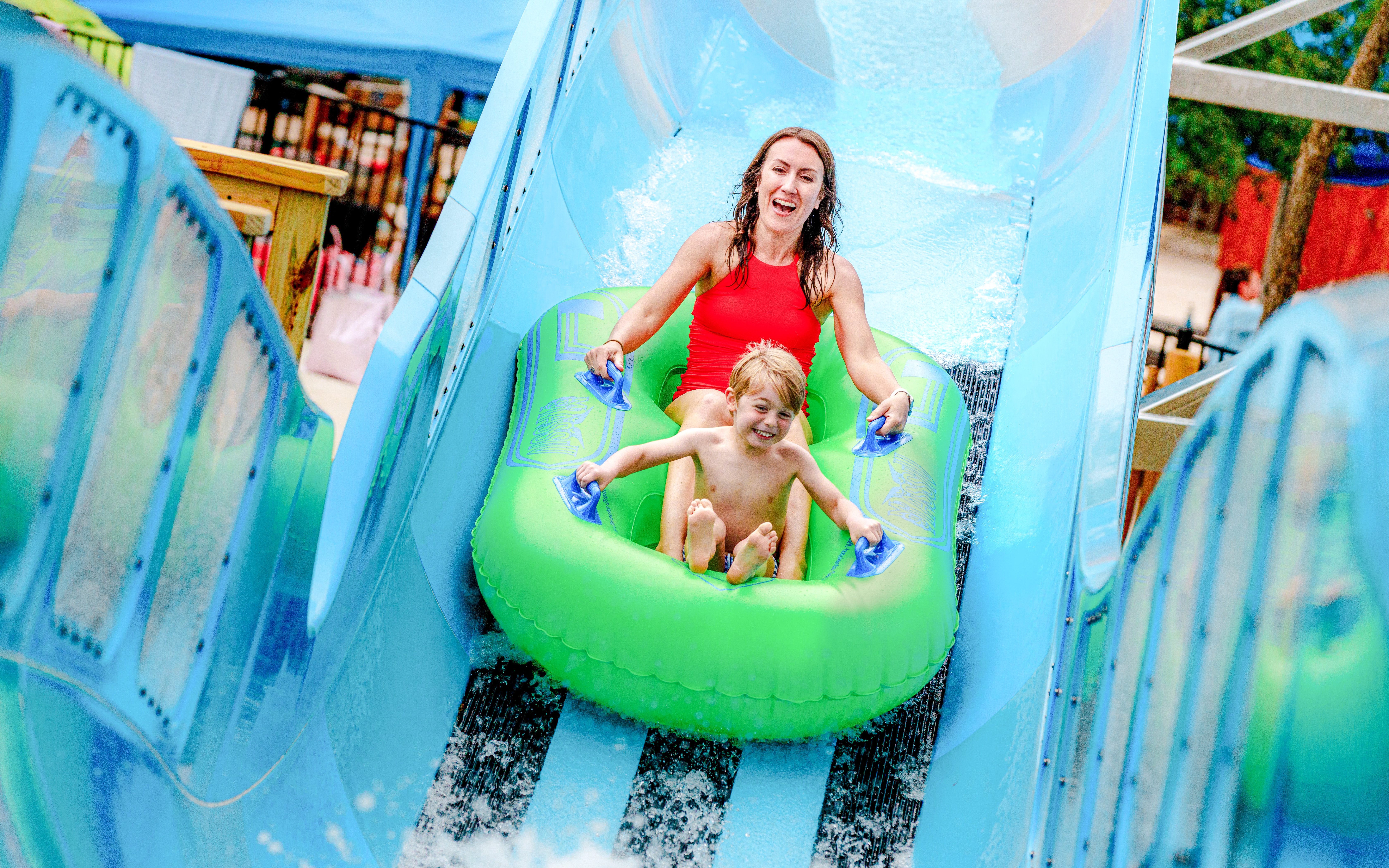 Visitors enjoying Bow Wow Blaster water slide at Schlitterbahn New Braunfels.