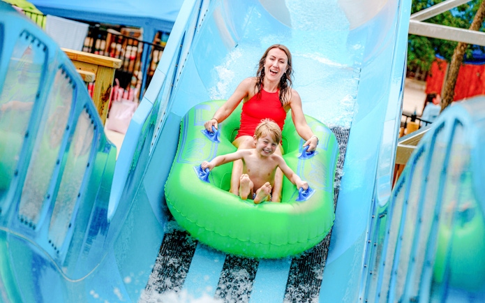 Visitors enjoying Bow Wow Blaster water slide at Schlitterbahn New Braunfels.