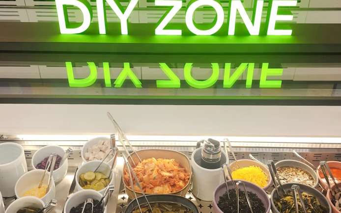 DIY food station with various toppings at Sky Hub Lounge, Seoul Incheon Airport East Concourse.