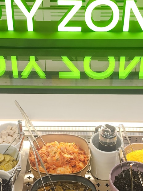 DIY food station with various toppings at Sky Hub Lounge, Seoul Incheon Airport East Concourse.