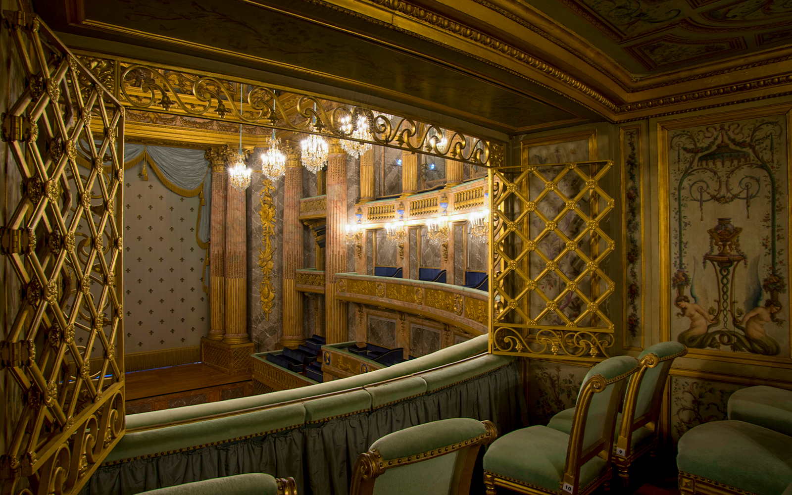 Special box VIP seats at Royal Opera, Versailles, offering exclusive view of ornate interior.