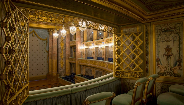 Special box VIP seats at Royal Opera, Versailles, offering exclusive view of ornate interior.