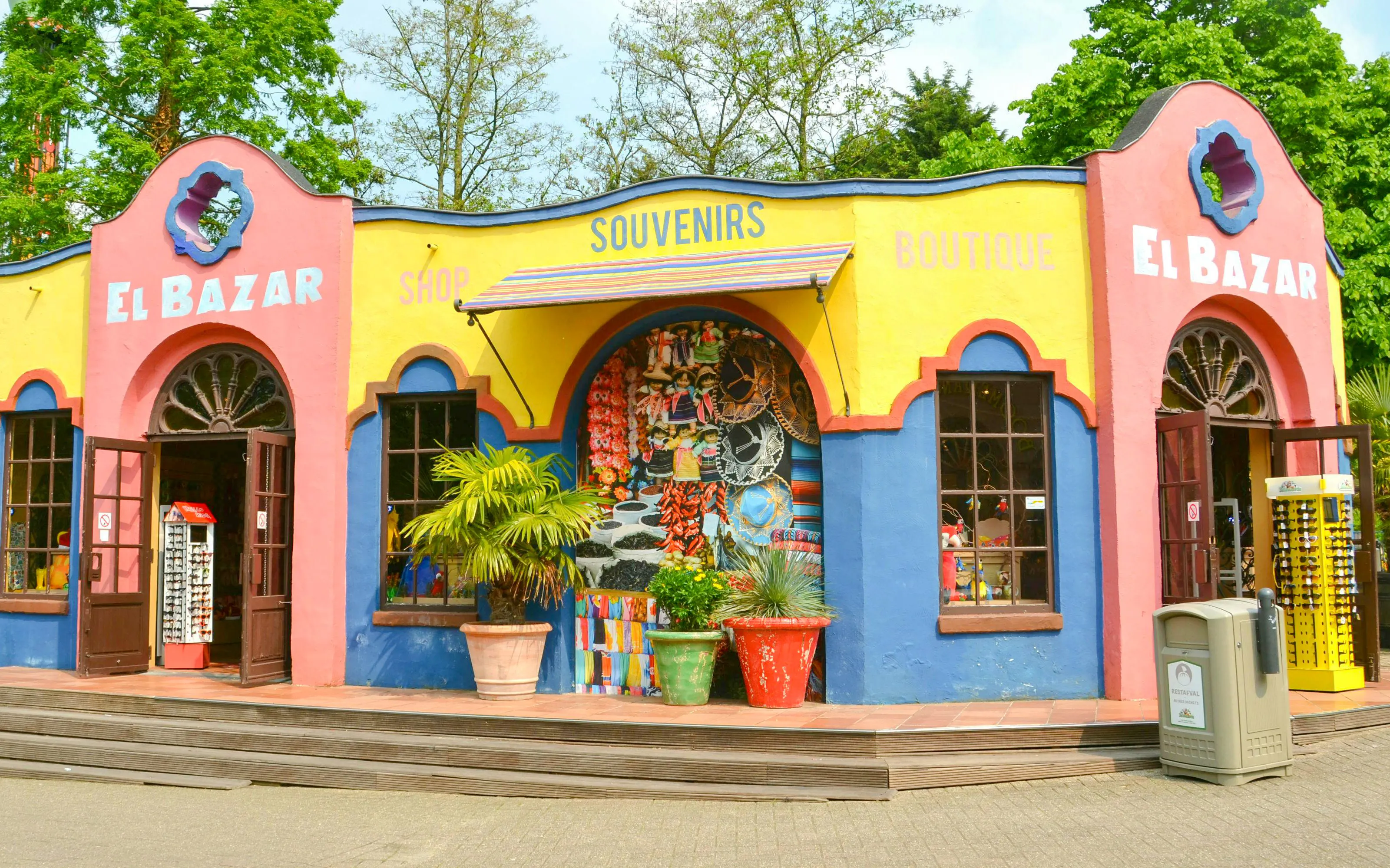 Souvenir shop at Bellewaerde Park, Belgium with colorful facade and open entrance.