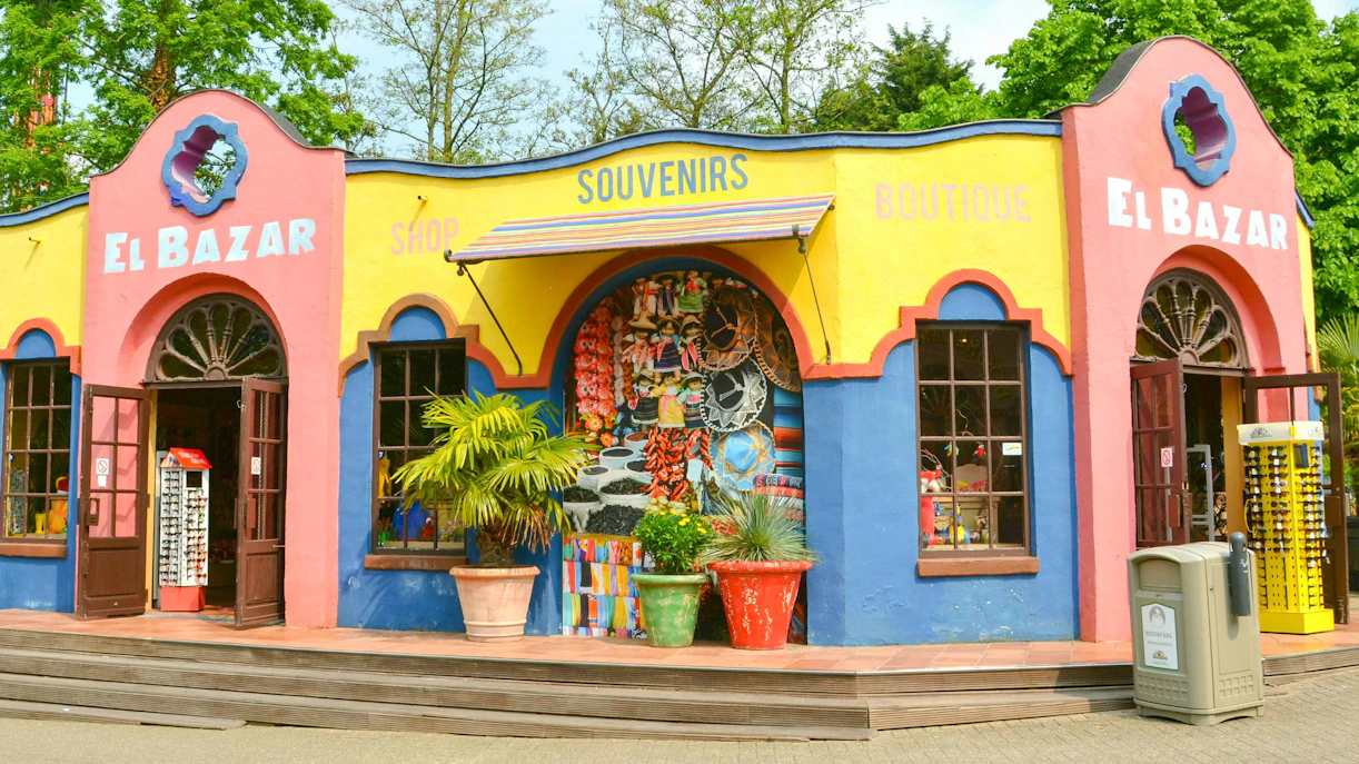 Souvenir shop at Bellewaerde Park, Belgium with colorful facade and open entrance.