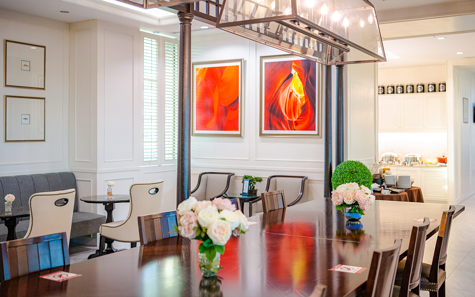 Dining area at The Coral Executive Lounge, Bangkok Airport, featuring elegant seating and decor.