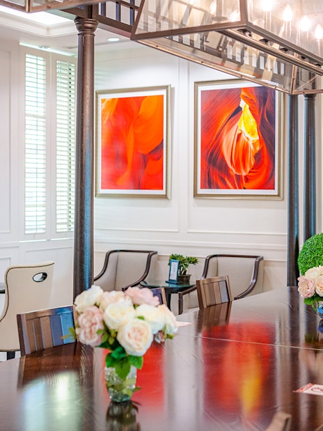 Dining area at The Coral Executive Lounge, Bangkok Airport, featuring elegant seating and decor.